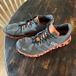 On. Cloud Running Shoes A dark gray and red- orange